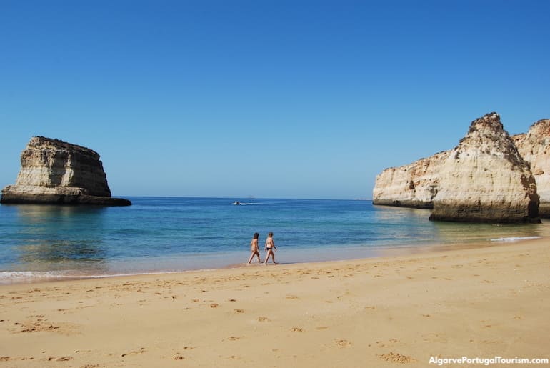 Golden rock formations in Praia dos Caneiros, Algarve