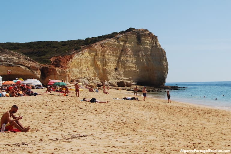 Sunbathing in Praia dos Caneiros, Algarve