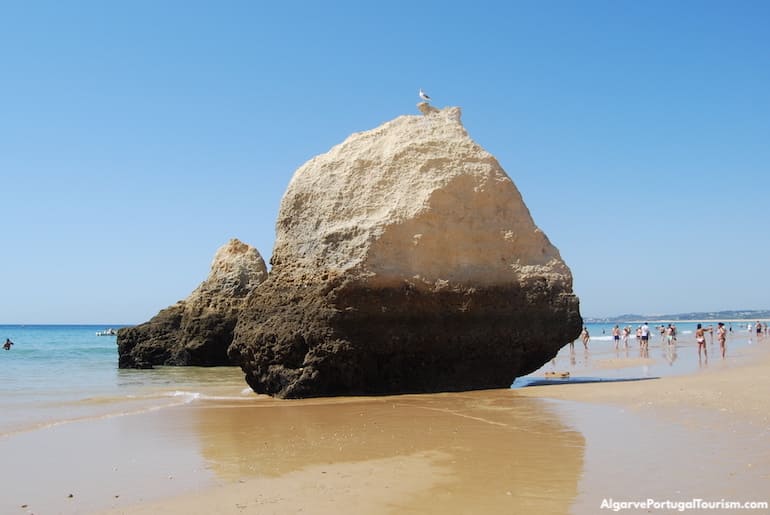 Rocks in the water in Praia dos Três Irmãos, Algarve