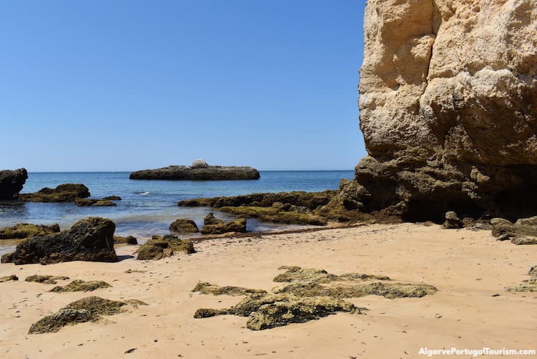 Submarine-shaped rock in the water in Submarino Beach, Algarve